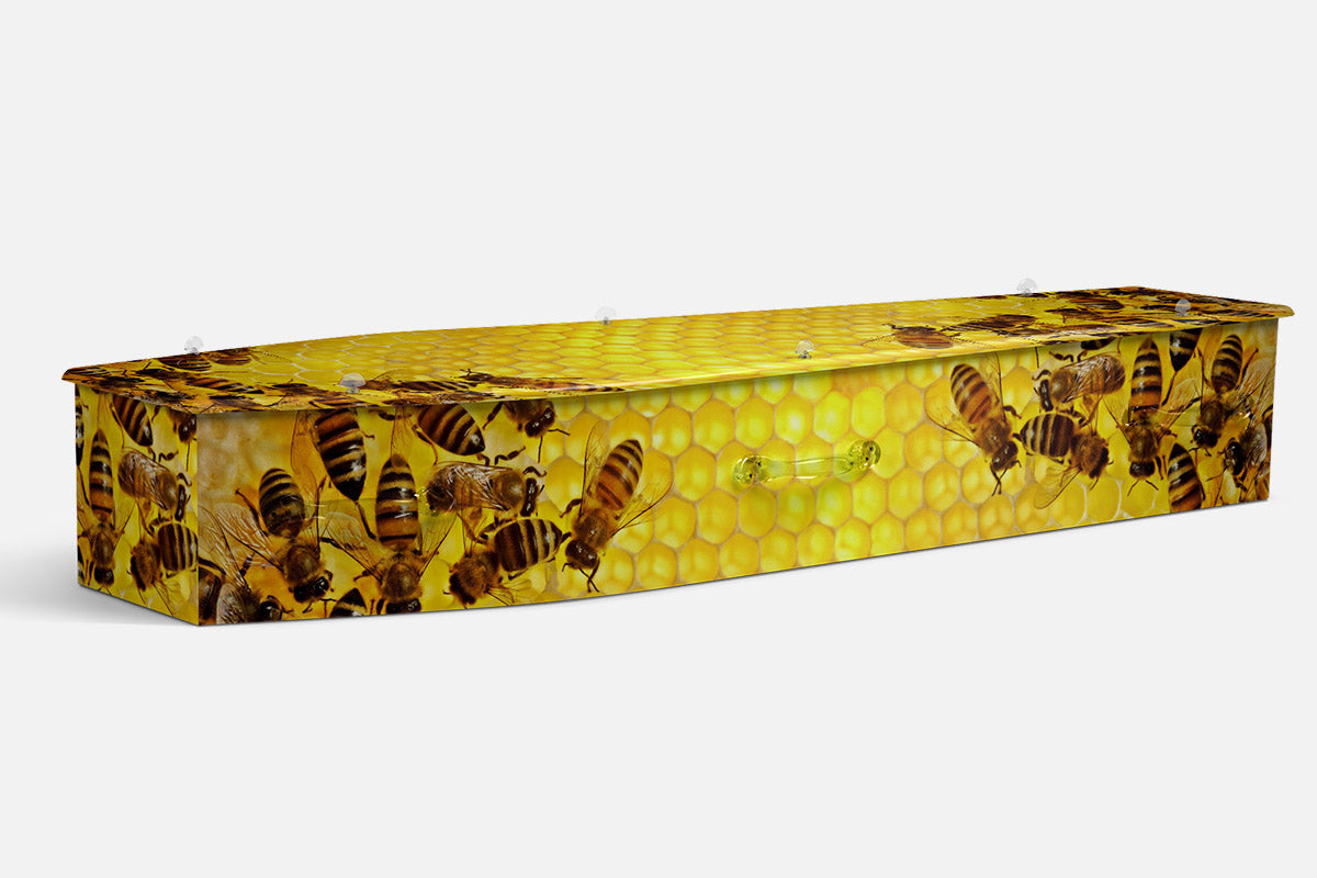 Beekeeper coffin in a photographic print of bees on a golden honeycomb pattern
