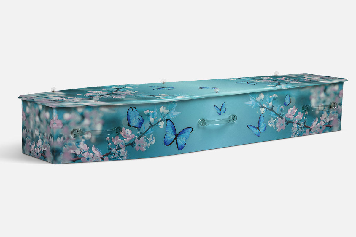 Blossoms Ballet coffin in teal with pink blossom branches and blue butterflies