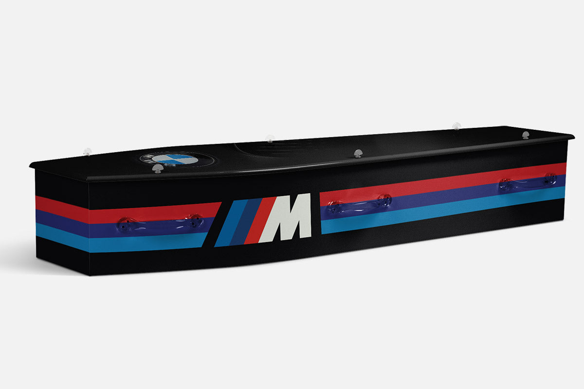 BMW coffin in black with red, blue and white M stripe accents and the BMW roundel emblem
