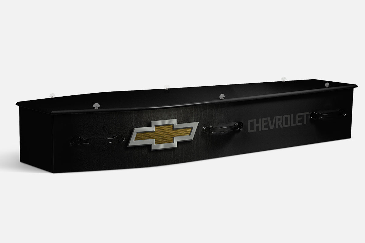 Chevrolet coffin in black with the gold Chevrolet bowtie emblem and Chevrolet lettering