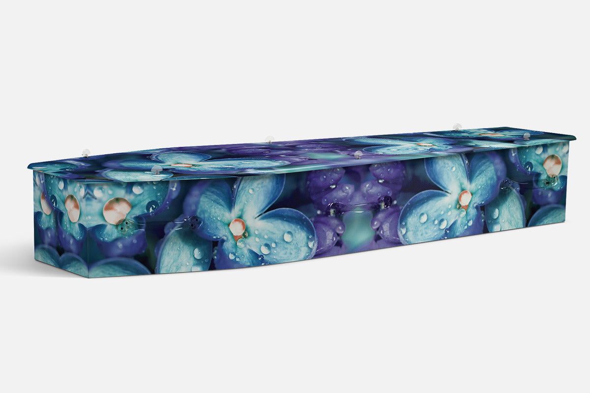 Cobalt Lilacs coffin in blue and purple flowers with visible dew drops