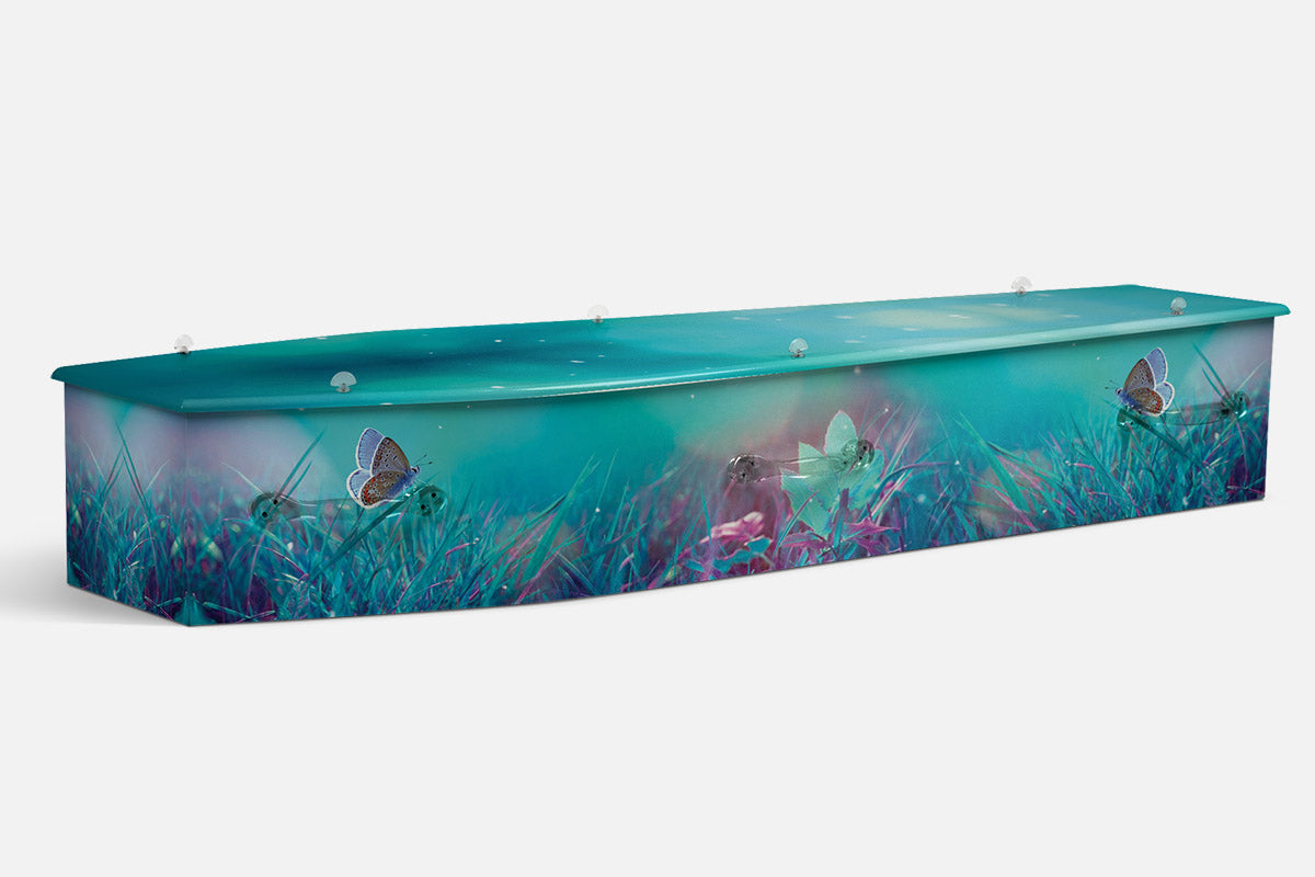 Dreamy Meadow coffin in teal and purple grass with butterflies and glowing fairy wings
