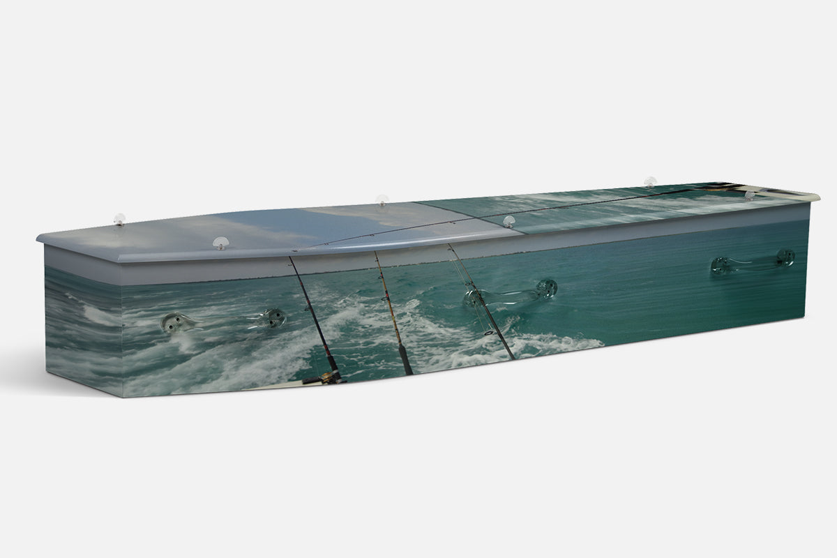 Fishing coffin in a photographic sea view with fishing rods trailing behind a boat and rolling waves