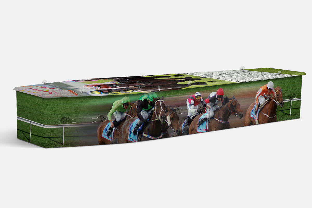 Horse Racing coffin showing jockeys in colourful silks racing horses down the home straight