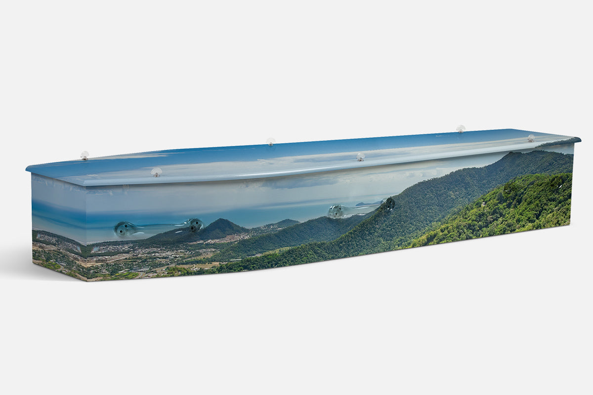 Karunda Rainforest coffin in a photographic aerial view of green mountains, coastline and rainforest canopy