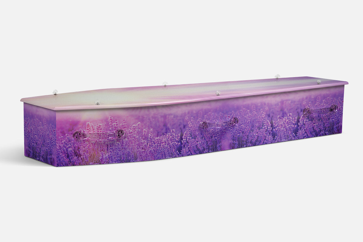 Lavender Meadow coffin in a deep violet lavender field under a soft pink sunset