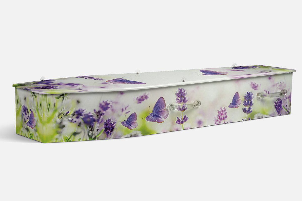 Lavender Wings coffin in lavender sprigs and blue butterflies over a soft green field