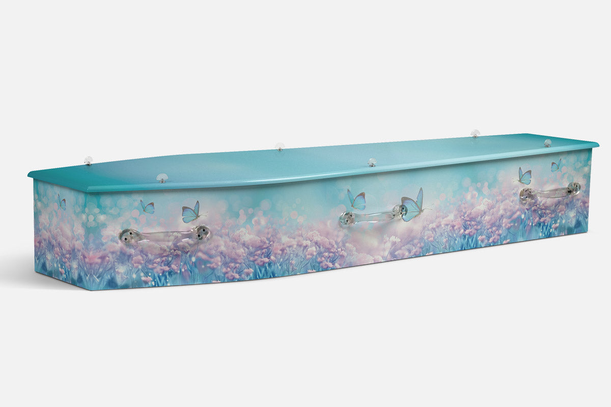 Lilac Meadow coffin in pink wildflowers over a soft teal blue background