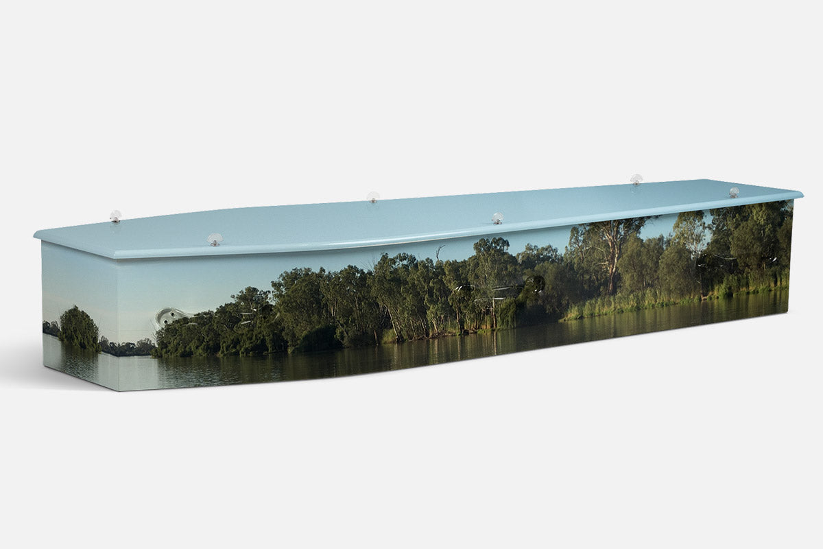 Murray Riverland coffin in a photographic sunset scene of orange cliffs and a calm river bend
