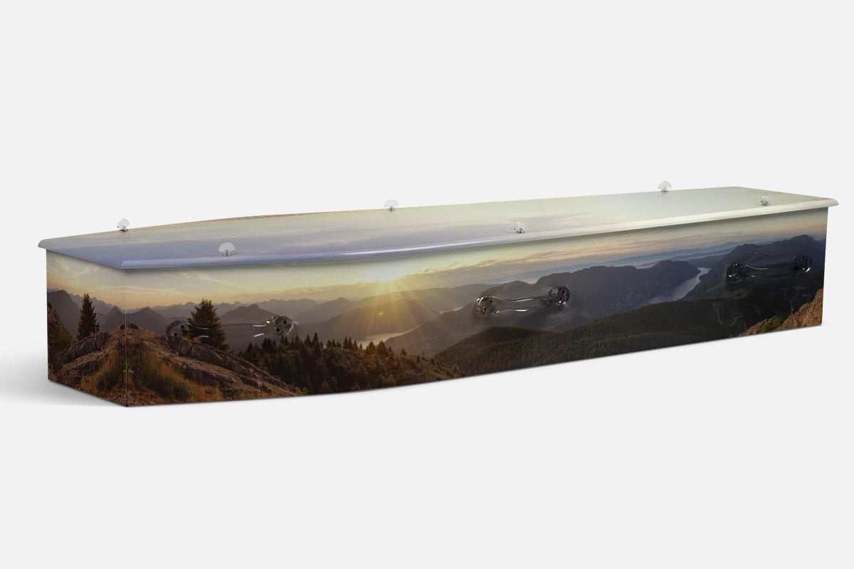 Nature Edenic Escape coffin in a mountain valley sunset with sun rays over forest and lake, photographic