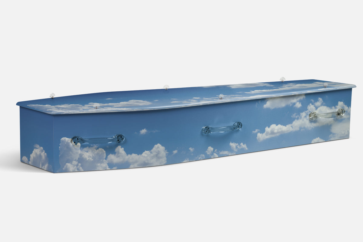 Nature Heavens Palette coffin in a bright blue sky filled with soft white clouds, photographic