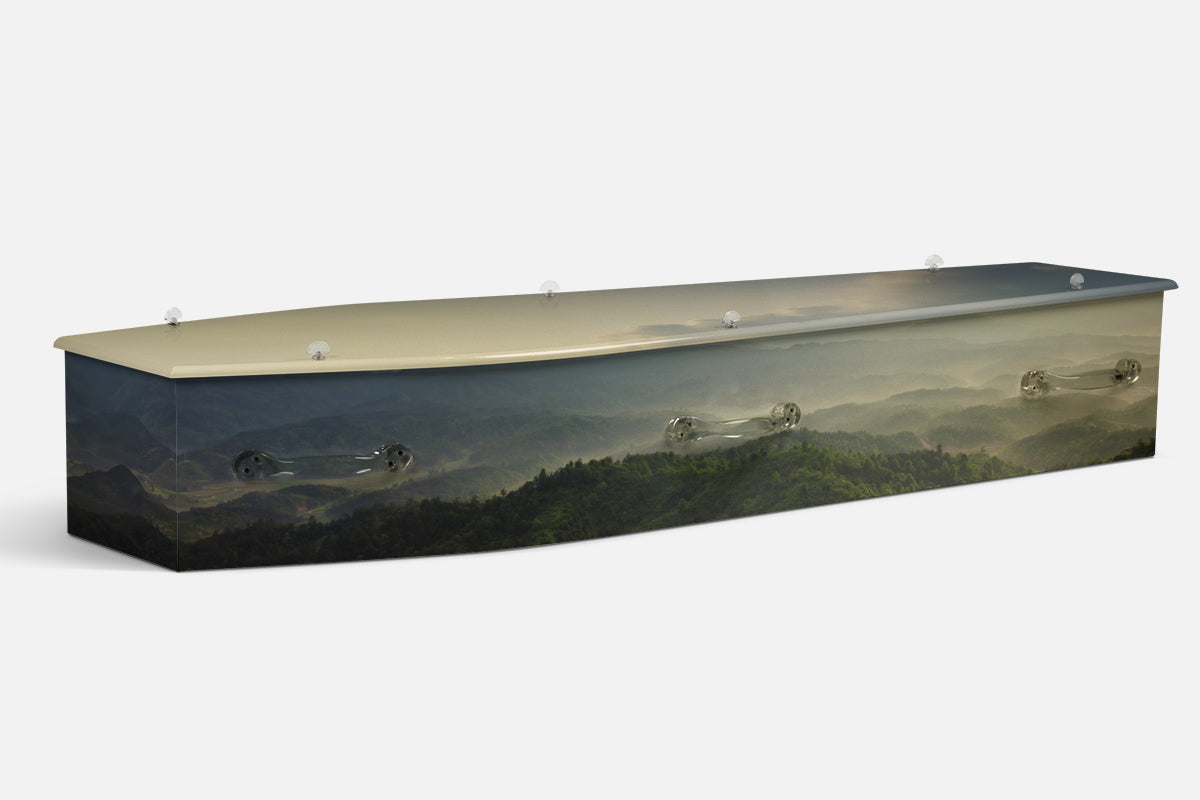 Nature Misty Mountains coffin in layered green ranges under a pale misty sky, photographic