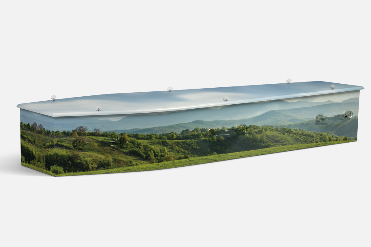 Nature Pristine Panorama coffin in green rolling hills and farmland under a hazy blue sky, photographic