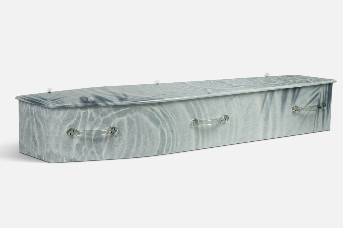 Nature Rainbow Reflections coffin in pale blue grey rippling water or sand pattern, photographic