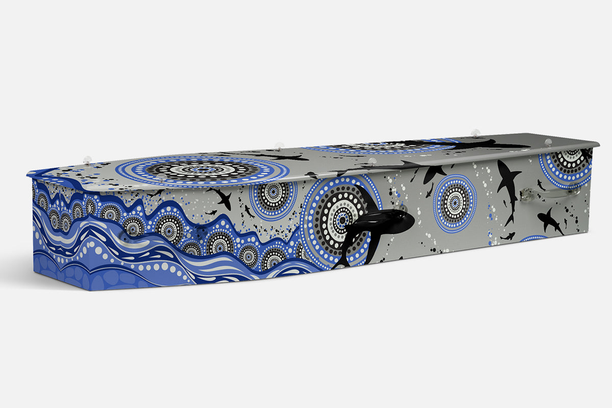 Ngurdungurdu coffin in blue and grey with dot circle patterns, waves and shark silhouettes