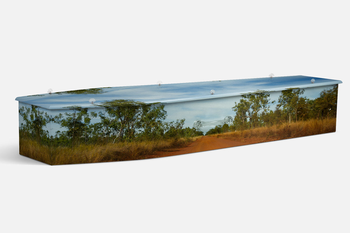 Outback Dirt coffin in a photographic scene of a red dirt track through gum woodland and gold grass