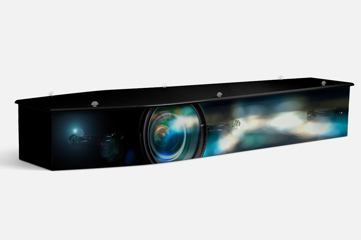 Photography coffin in a close up photograph of a camera lens with blue bokeh lights on a dark background