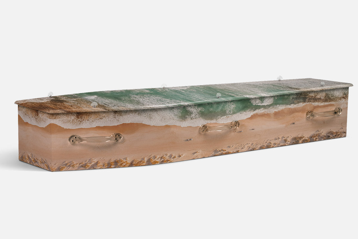 Serene Coastline coffin in an aerial view of green waves breaking on a sandy shore