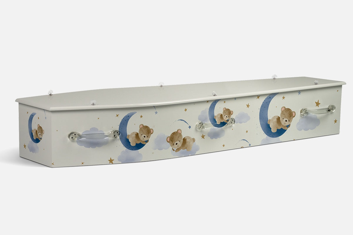 Sleepy Bears coffin in soft cream with illustrated bears curled asleep on blue crescent moons, clouds and gold stars