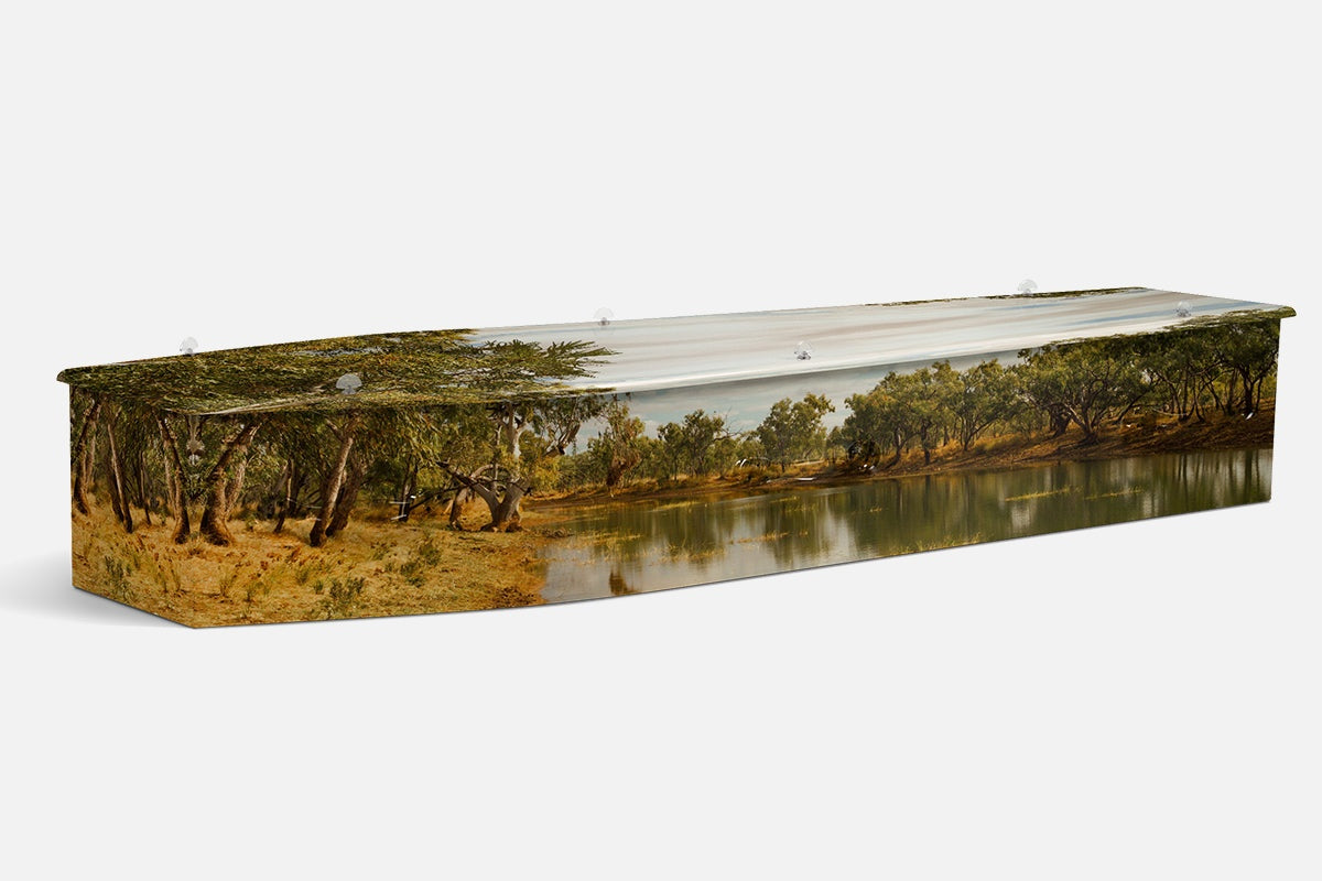 The Creek coffin showing gum trees along a still waterway under a soft overcast sky