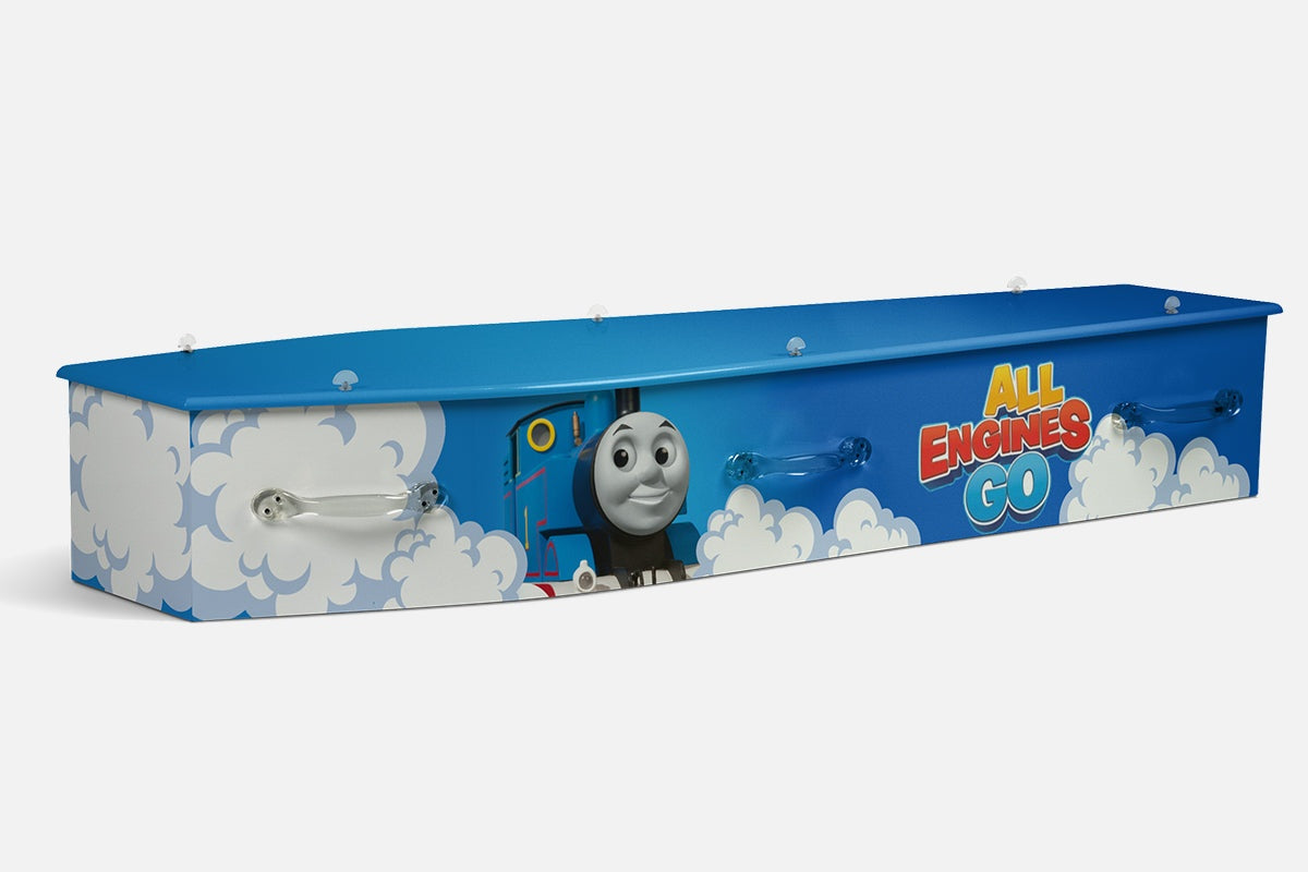 Thomas coffin in blue with the Thomas the Tank Engine train character among clouds and All Engines Go lettering