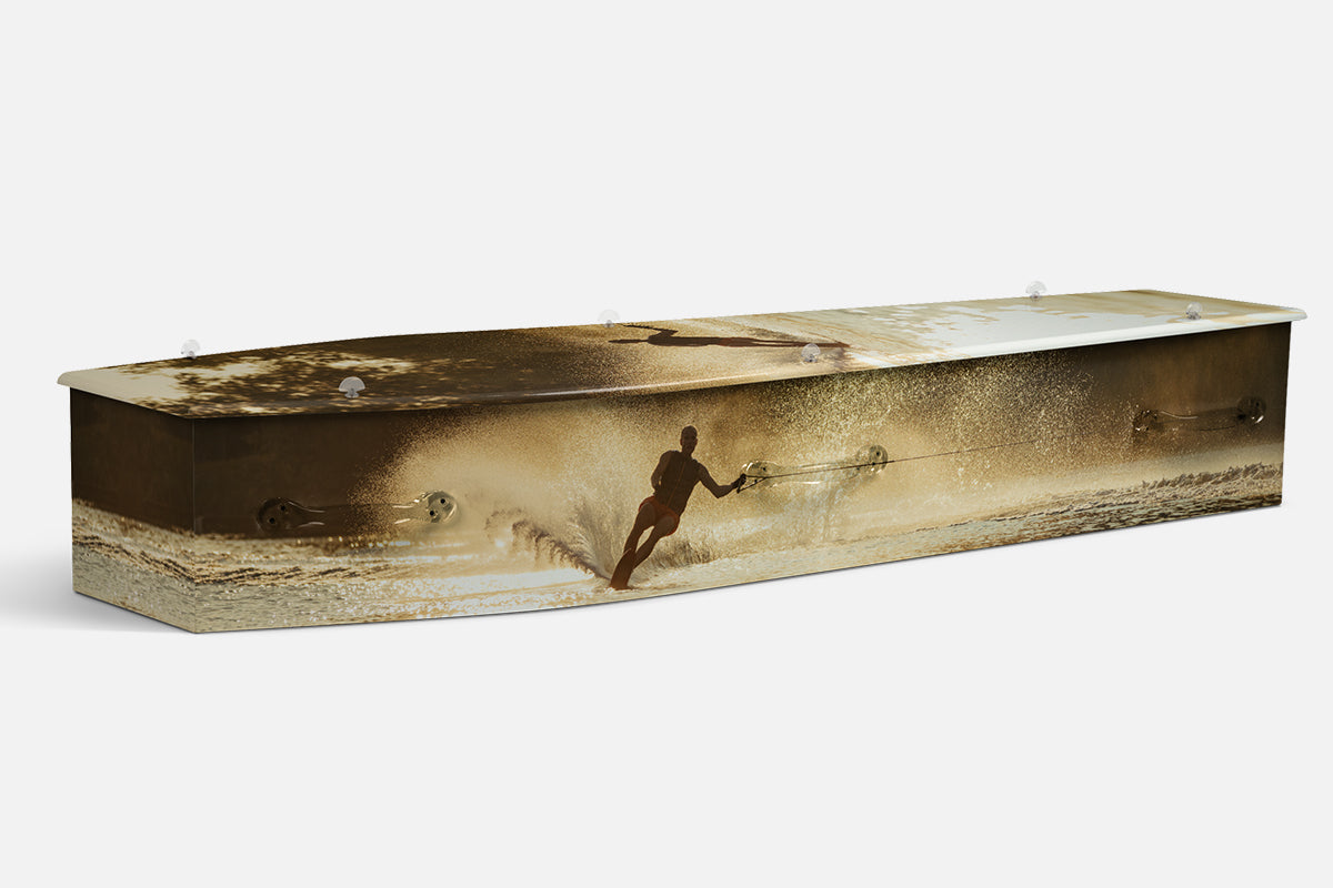 Water Skiing coffin showing a silhouetted water skier throwing up spray at golden sunset